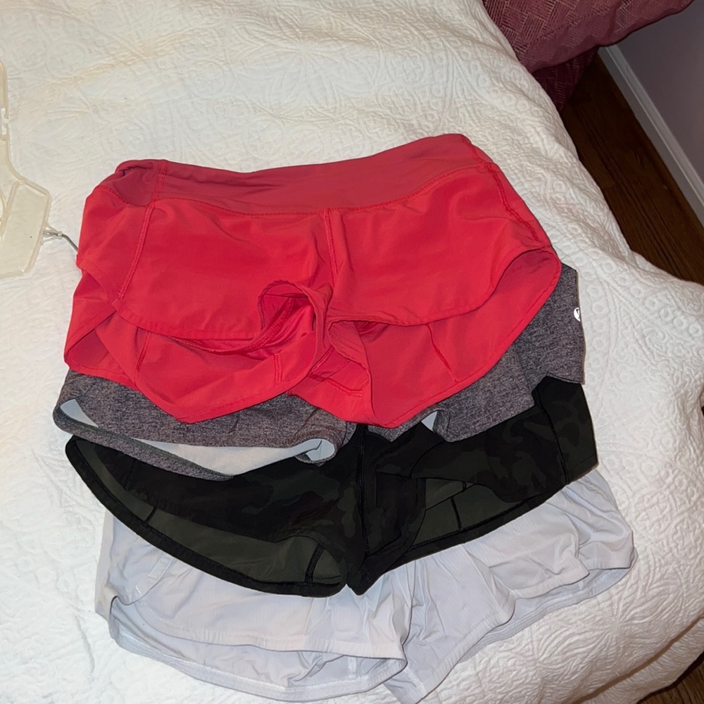 Four pairs of lightly worn Lulu Lemon shorts